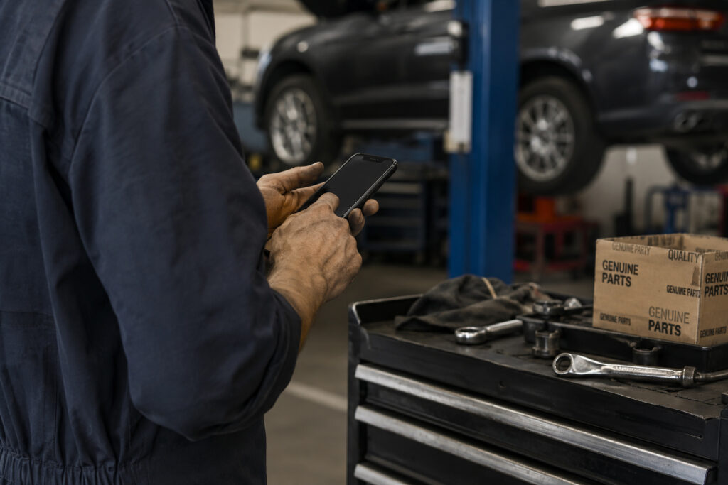 Mechanic servicing a wheel hub and brake assembly